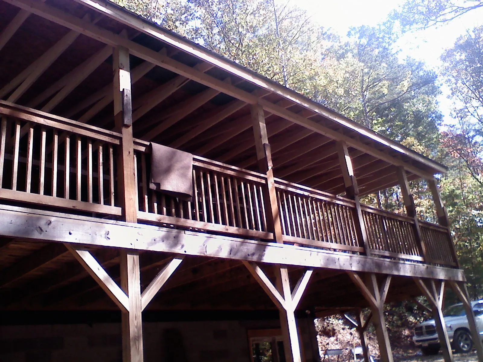 Timber framing under a new elevated porch and deck — Roof Leak Repair in Prairie View by Roofing Brothers